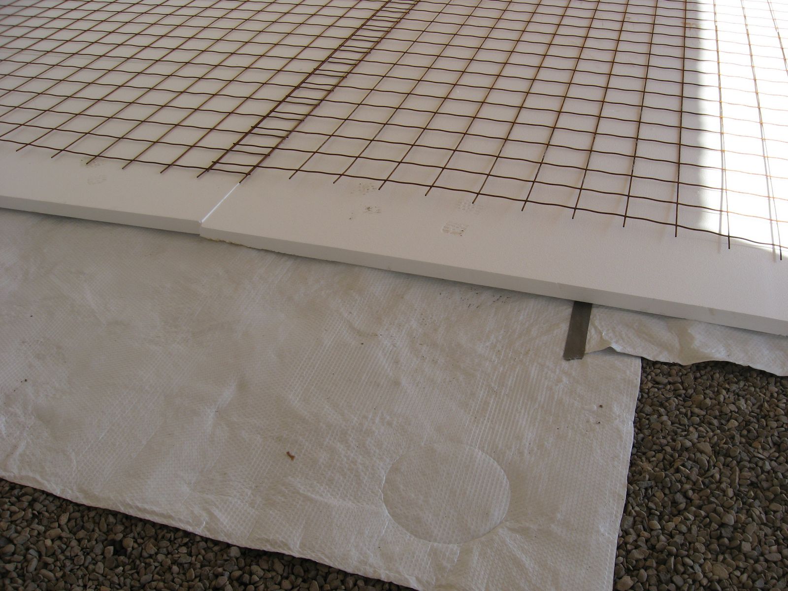 Interior insulated floor slab with radiant heat