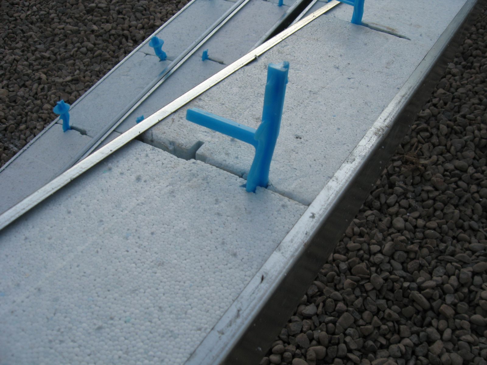 Structural steel door bucks with Quad-Lock insulation inserts for garage doors