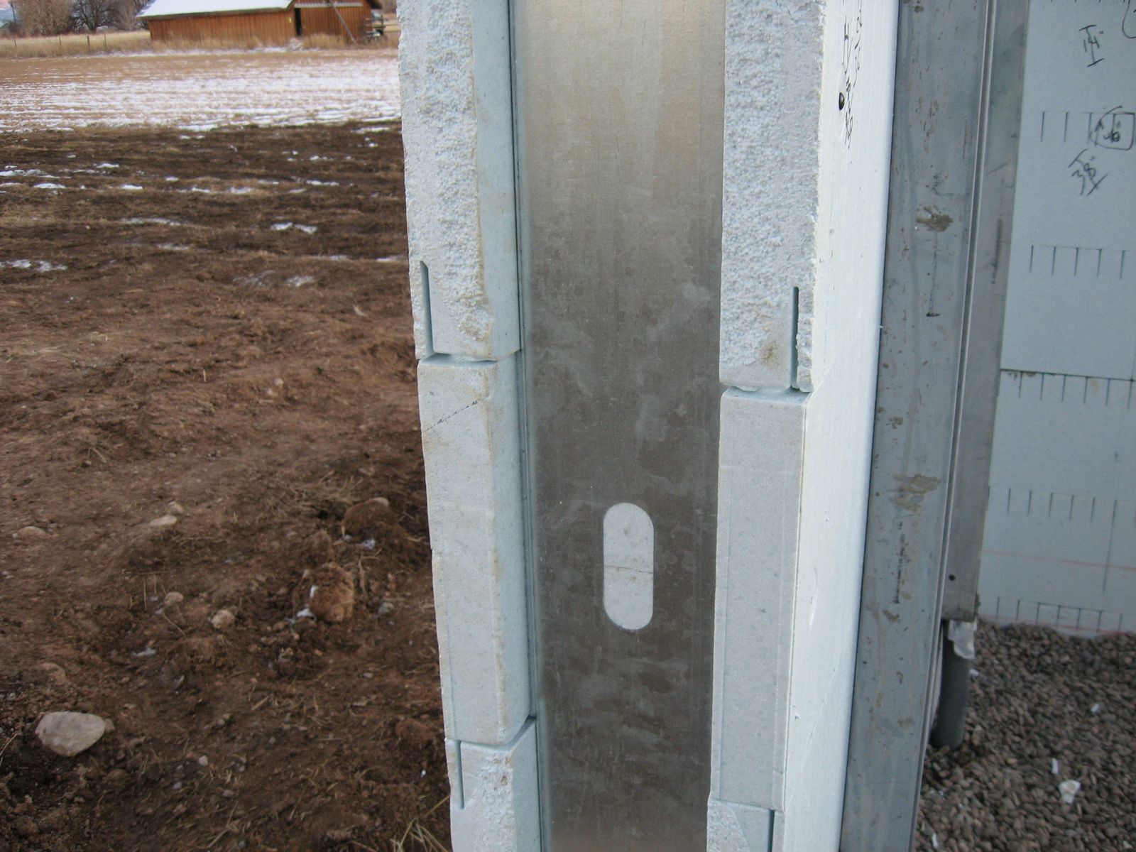 Structural steel door bucks with Quad-Lock insulation inserts for garage doors