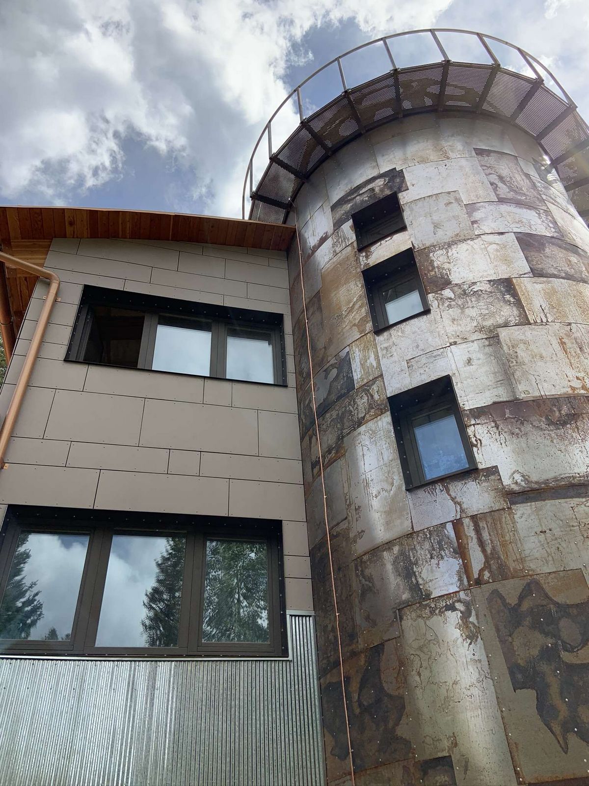 Quad-Lock ICF Home Addition with Radius Walls in Black Hawk beautiful exterior cladding on turret and home extension