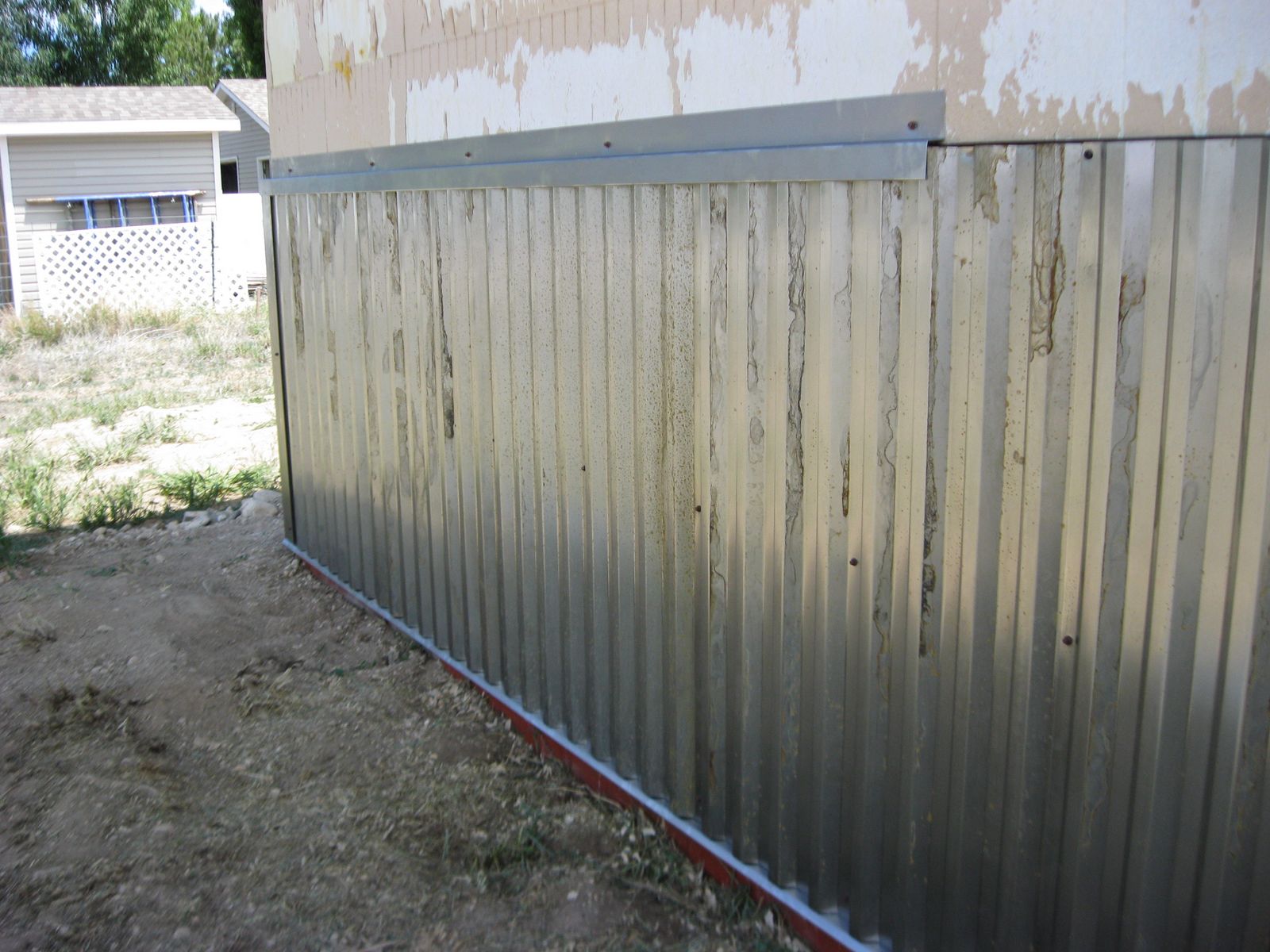 Exterior rusty metal wainscot application